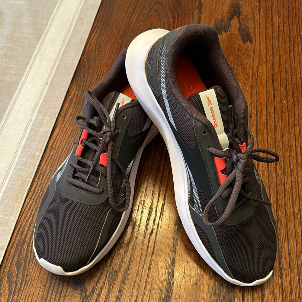 Reebok dark gray sneakers with neon orange detail